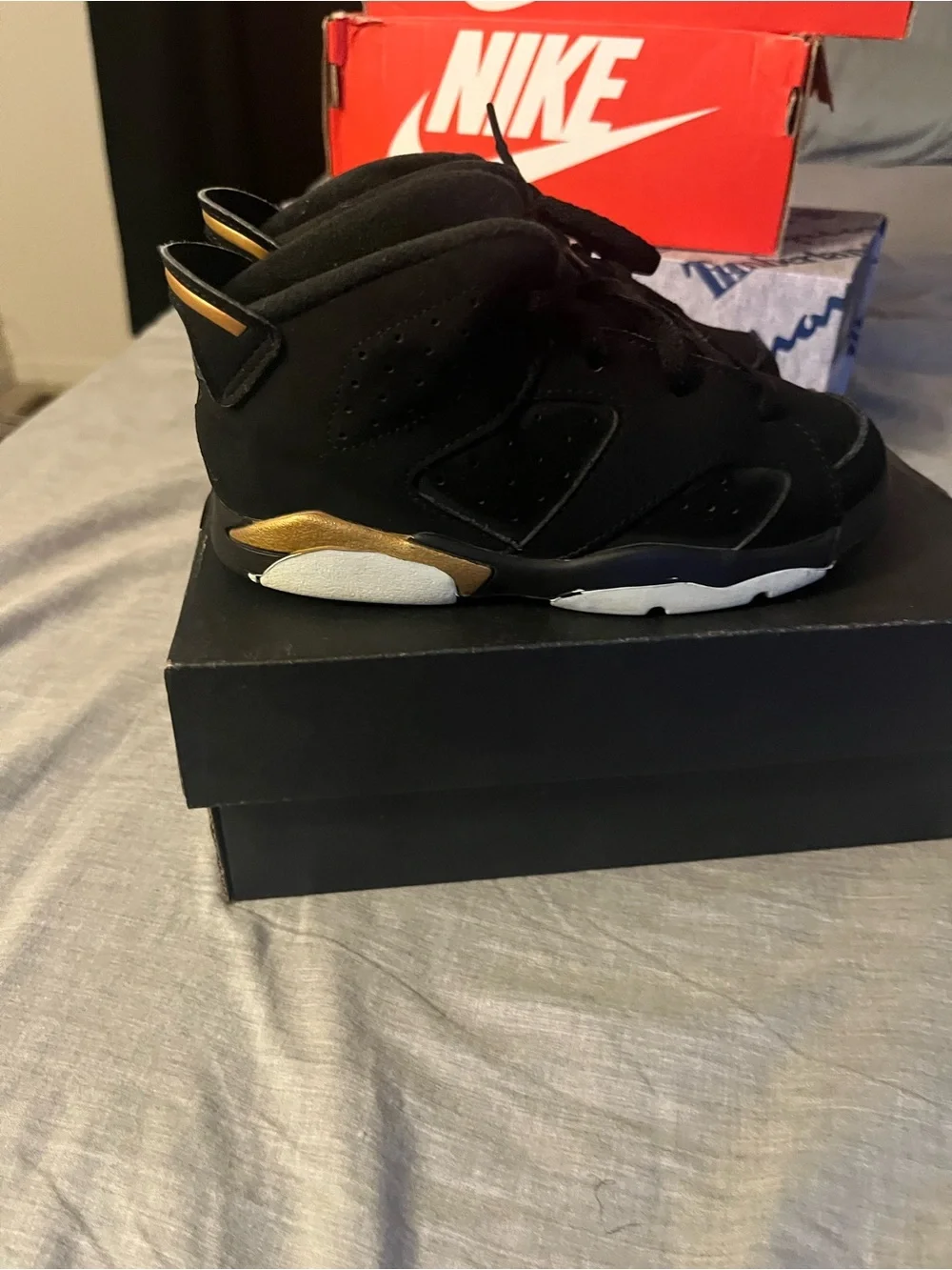 Jordan Kids Black High-Top Sneakers with Gold Accent